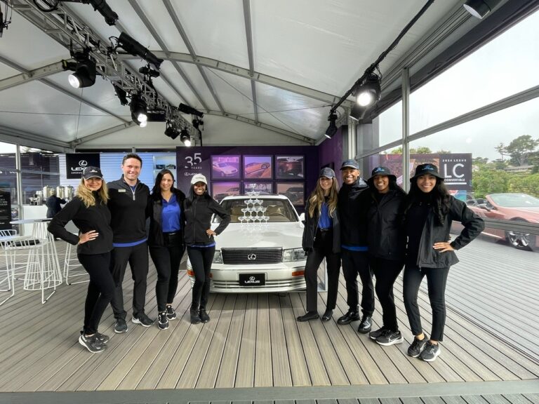 Lexus product specialists in front of display at Pebble Beach Concours d'Elegance